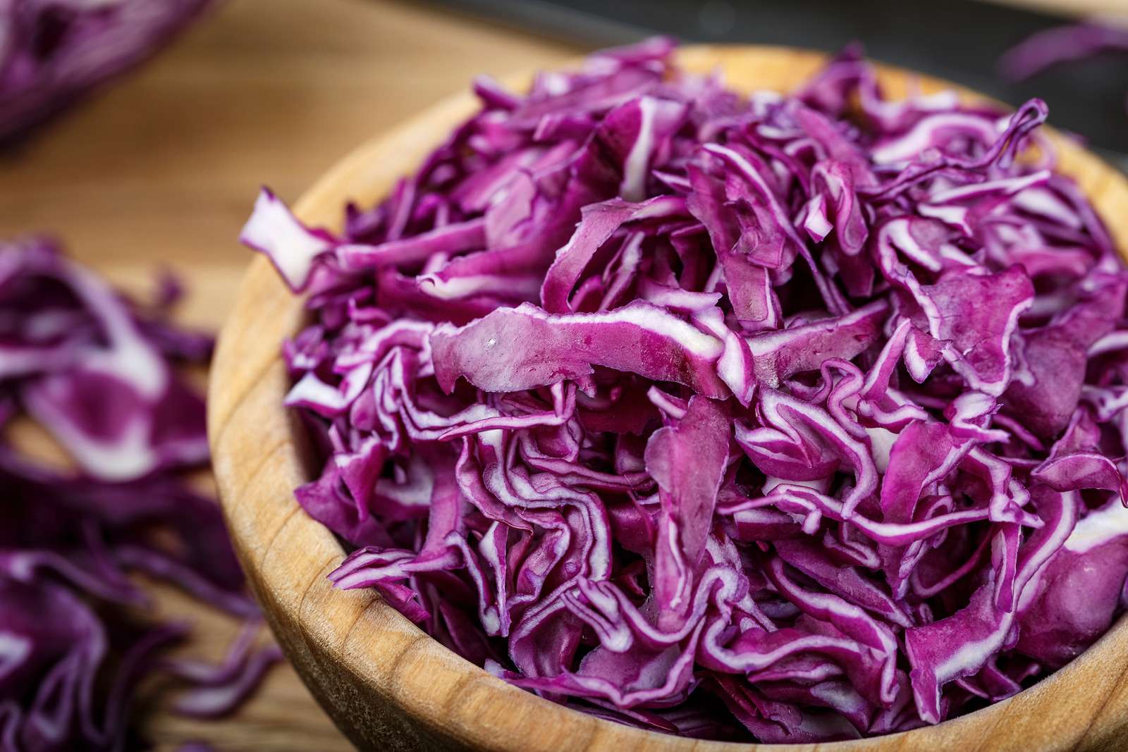 chopped purple cabbage. salad of useful violet cabbage on a wooden background